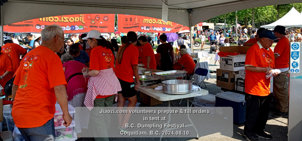 view from back showing more volunteers working to fill orders